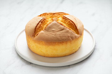 Japanese cheesecake on a white plate, selective focus