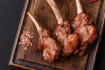 Delicious juicy meat on the bone or rack of lamb or grilled veal