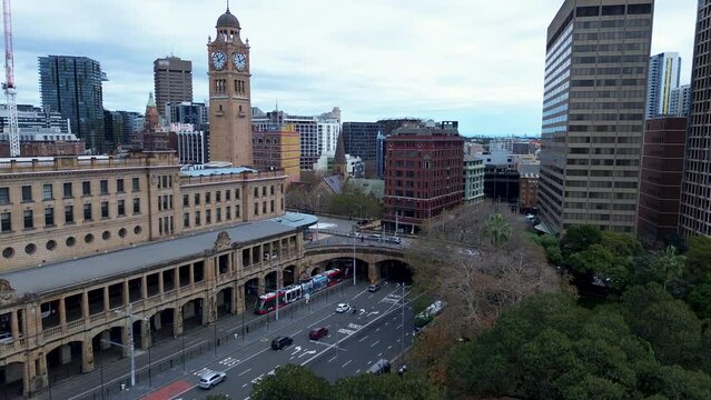 Landscape view of cars on busy main street Central Station Clock Tower building in Sydney City CBD skyline Haymarket Surry Hills Australia travel tourism