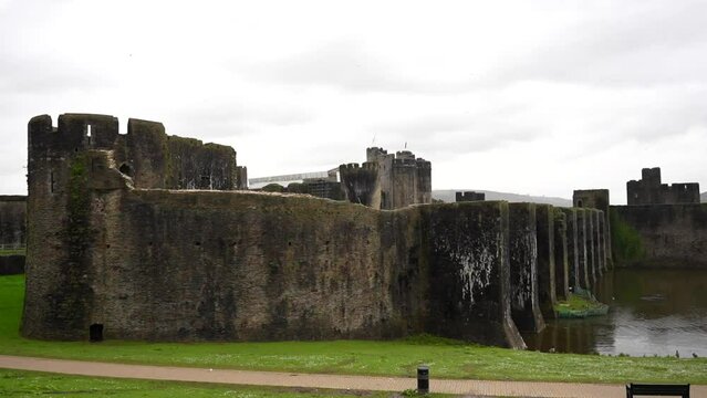 Static shot of exterior wall of Caerphilly Castle on a rainy day, Wales