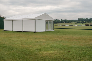 Marquee in field at Cowdray polo fields