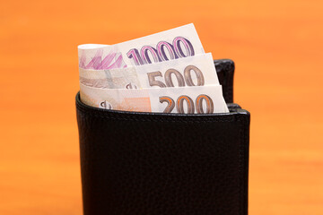 Czech koruna in the black wallet