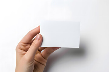 Fototapeta premium Business card mockup in woman's hand. Blank calling card template isolated on white background