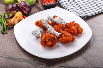 Indian cuisine glazed chicken lollipop