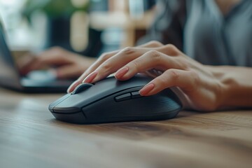 Person operating mouse on desk