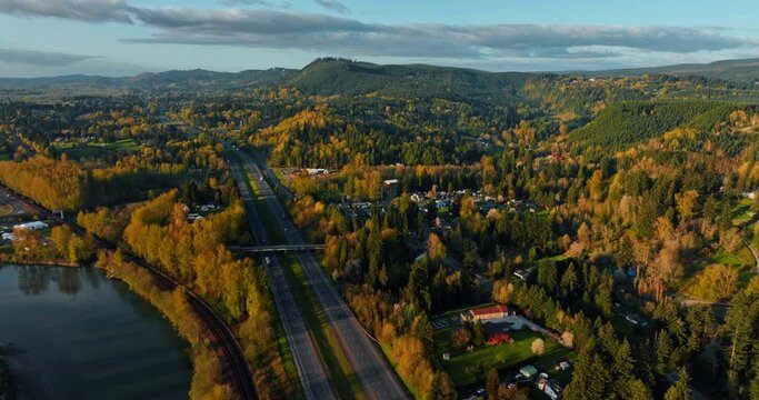 Two parallel highways passing through the picturesque landscape. Mountainous scenery of Oregon countryside at sunset. Top view.