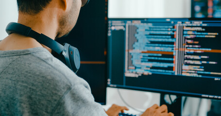 Closeup Adult Asia male, female freelance typing write prompt AI bot IT app smart program nomad, video game, terminal with coding language, user interface, designer, big data center desktop computer.