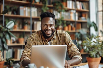 Man smiling at laptop