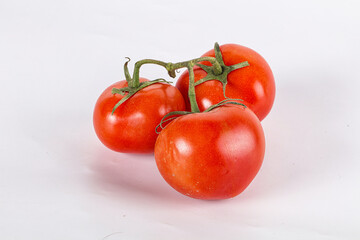 Sweet ripe tomatoes on the branch