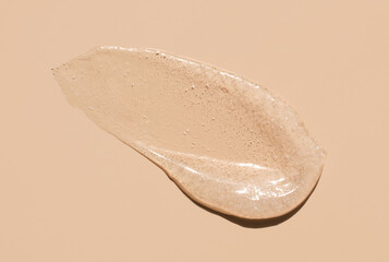 cosmetic smears scrub peeling cream texture on a beige background