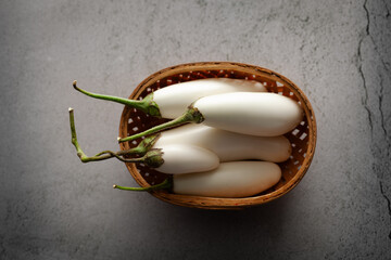 Close-up of organic white fresh Eggplant or Brinjal (Solanum melongena),  on a marble background.
