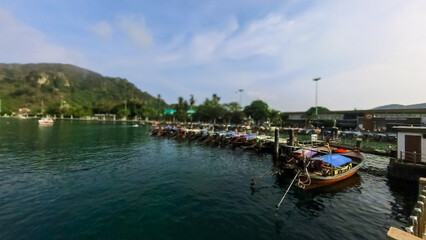 seascape background with Phi Phi Island Port and Tonsai Pier, Thailand.