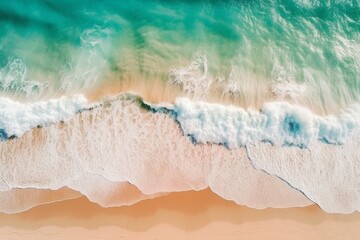Aerial view of beautiful sea waves Pink sand and emerald green waters Amazing waves crashing on the sandy beach.