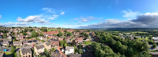 A drone's-eye view captures Dewsbury Moore Council estate's fame, a typical UK urban council-owned housing development with red-brick terraced homes and the industrial Yorkshire