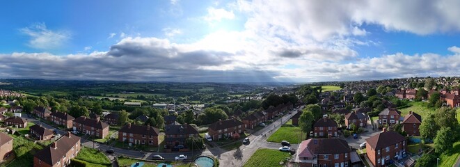 A drone's-eye view captures Dewsbury Moore Council estate's fame, a typical UK urban council-owned...