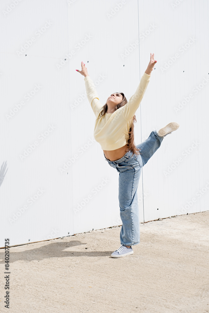 Canvas Prints plus size woman wearing casual clothes dancing on white wall background in the street