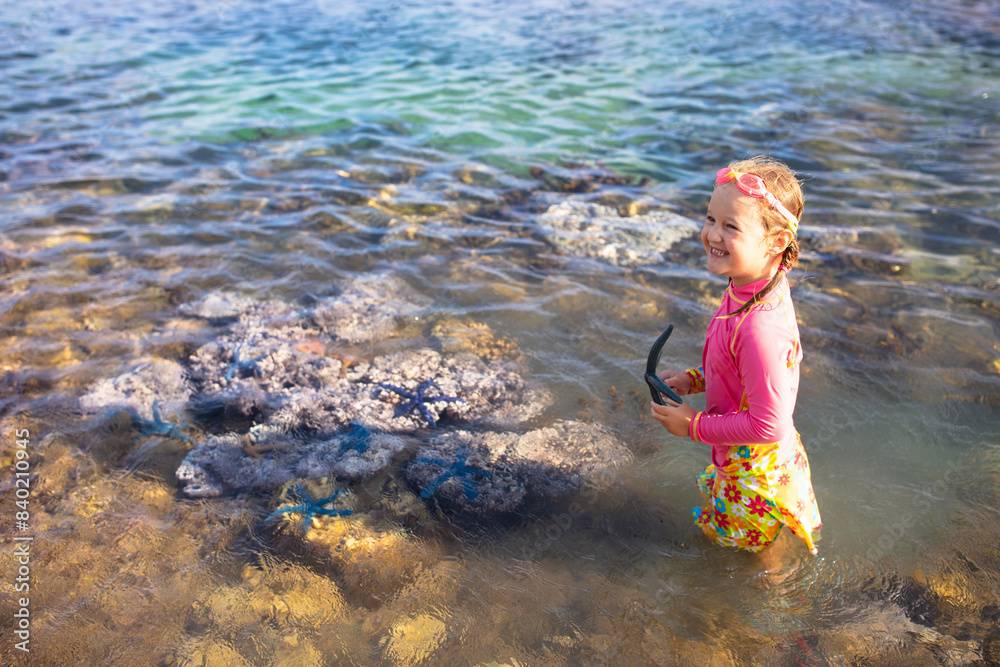 Wall mural Child snorkeling. Kids underwater. Beach and sea.