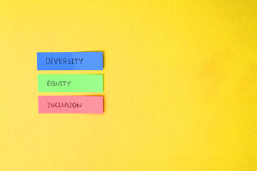 Diversity Equity And Inclusion Text Handwritten On Color Paper Notes Stick Over Yellow Background 