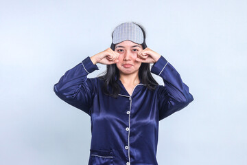 Young Asian Woman Wear Pajamas And Sleep Eye Mask Feeling Very Upset and Unhappy, Crying and...