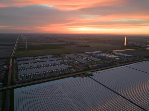Large scale data center building complex in Middenmeer, The Netherlands, at night.