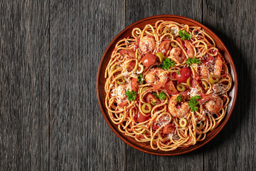 shrimp fra diavolo with spaghetti on a plate