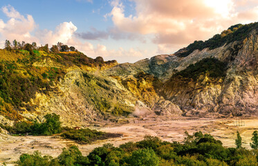 landscape of Plegrean volcano fields in Naples Italy near Pompeii with sulfur yellow caldera duribg eruption of smoke. campi Flegrei and cataclysm of Earthquake