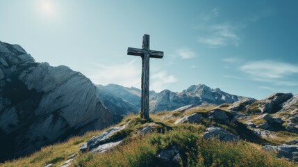 A Christian symbol perched atop a hill, overlooking majestic mountain scenery