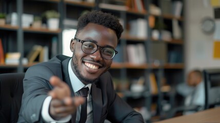 Obraz premium A professional man sits at his desk, focused on his work