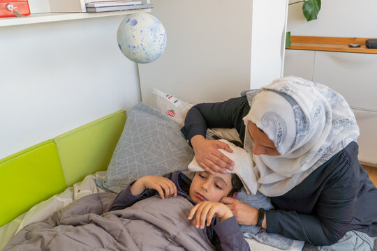 Mother caring for son during hypoglycemic episode