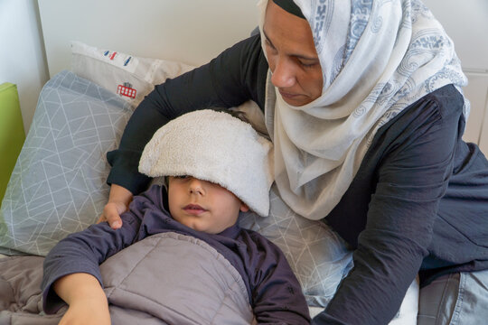 Mother caring for son during hypoglycemic episode