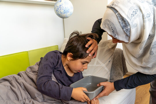 Caring unrecognizable mother comforts her child during a hypoglycemic episode