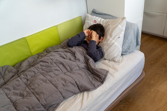 Child experiencing a hypoglycemic episode in bed