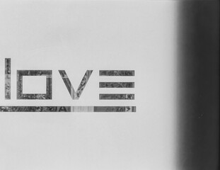 Expressing Romance. Love Letters Printed on Glass Backgrounds. Black and white, monochrome