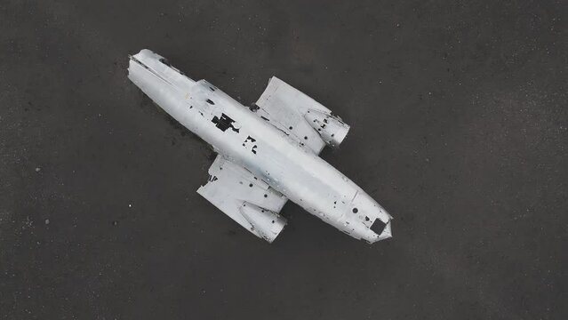 Aerial view of the Solheimasandur Plane Wreck in Iceland. Wrecked old plane Dakota on the black sand beach, south coast of Iceland