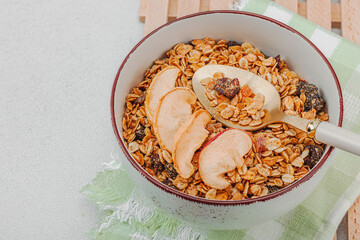 Vegan bowl with cereal granola with dried fruits. Ready to eat food, healthy breakfast concept