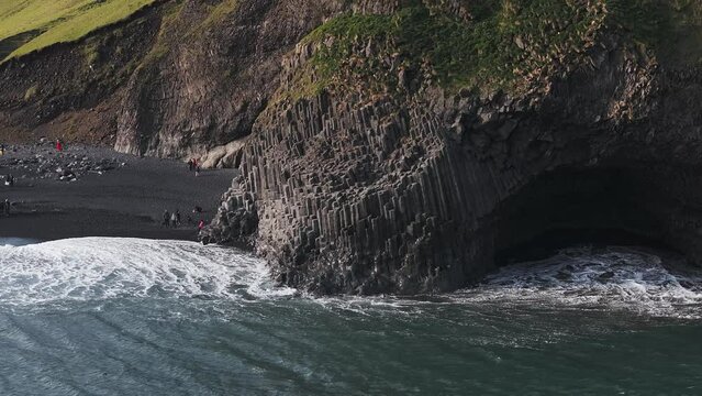 Aerial view of the Rynisfjara black sand beach in Iceland. Black sand beach and Reynisdrangar stack rocks of Vik i myrdal, Iceland. Famous basalt rocks on black sand beach near Vik