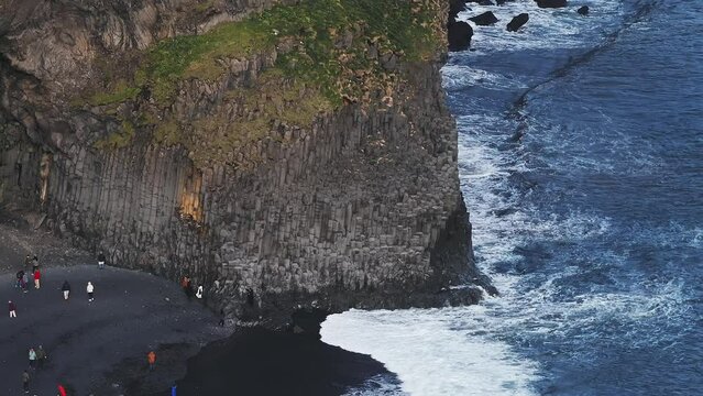 Aerial view of the Rynisfjara black sand beach in Iceland. Black sand beach and Reynisdrangar stack rocks of Vik i myrdal, Iceland. Famous basalt rocks on black sand beach near Vik