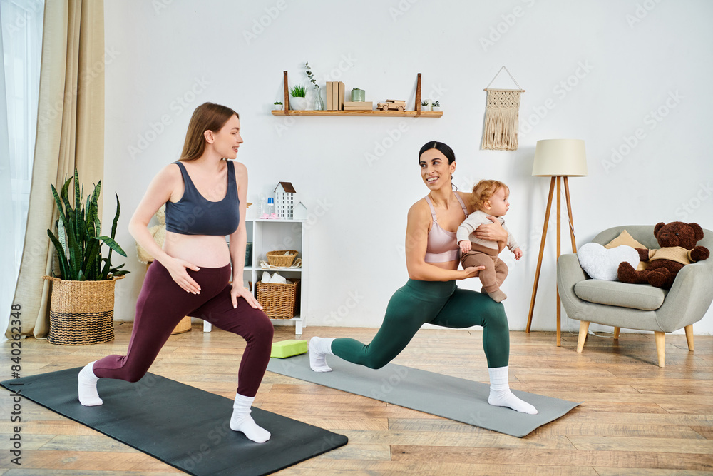 Wall mural A young beautiful mother and her baby are practicing yoga poses together at home with the guidance of an instructor.