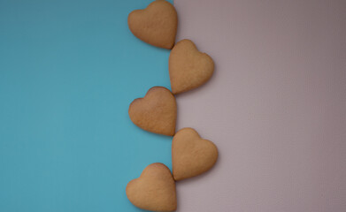 Background pink and blue with hearts baked goods for loved ones