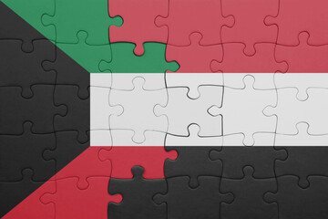 Fototapeta premium puzzle with the colourful national flag of yemen and flag of kuwait .
