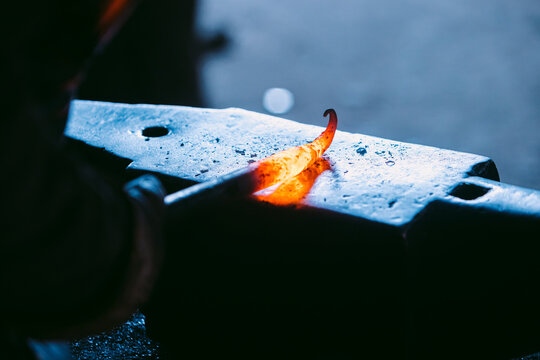 Traditional Blacksmith Forging Iron on Anvil