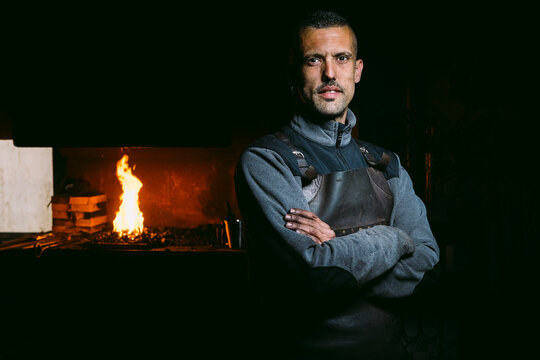 Male Blacksmith at Work in a Traditional Forge
