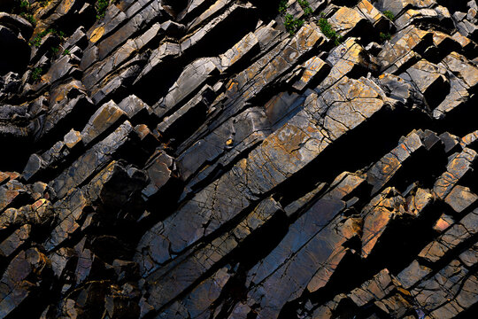 Jagged rock formations in a rugged landscape close-up