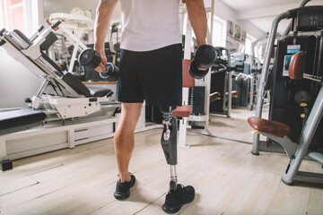 Athlete amputee's leg, showcasing a prosthesis in action during a gym workout