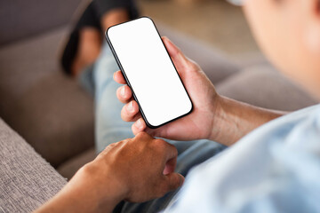 cell phone blank white screen mockup.hand holding texting using mobile on desk at office.background empty space for advertise.work people contact marketing business,technology