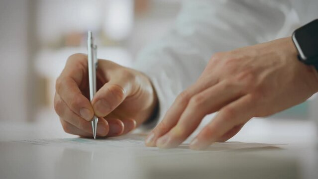 Pharmacy. Pharmacy medical worker uses skills to write with a pen while signing a doctor's prescription at a health center. European specialist issues paper documents and complies with service rules