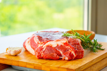 Fresh Raw Veal Cut of Meat with Spices and Rosemary Ready to Cook Close Up