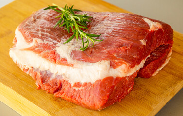 Fresh Raw Veal Cut of Meat with Spices and Rosemary Ready to Cook Close Up