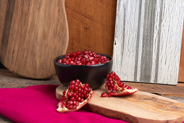 Gathering fresh pomegranate arils from fresh fruit.    