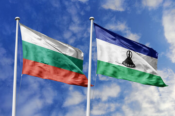 3D illustration. Bulgaria and Lesotho Flag waving in the sky. High detailed waving flag. 3D render. Waving in the sky. Flags fluttered in the cloudy sky.